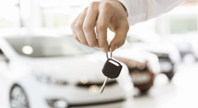 Customer receiving car keys after purchasing used car at JDB Motors Fort Smith Arkansas